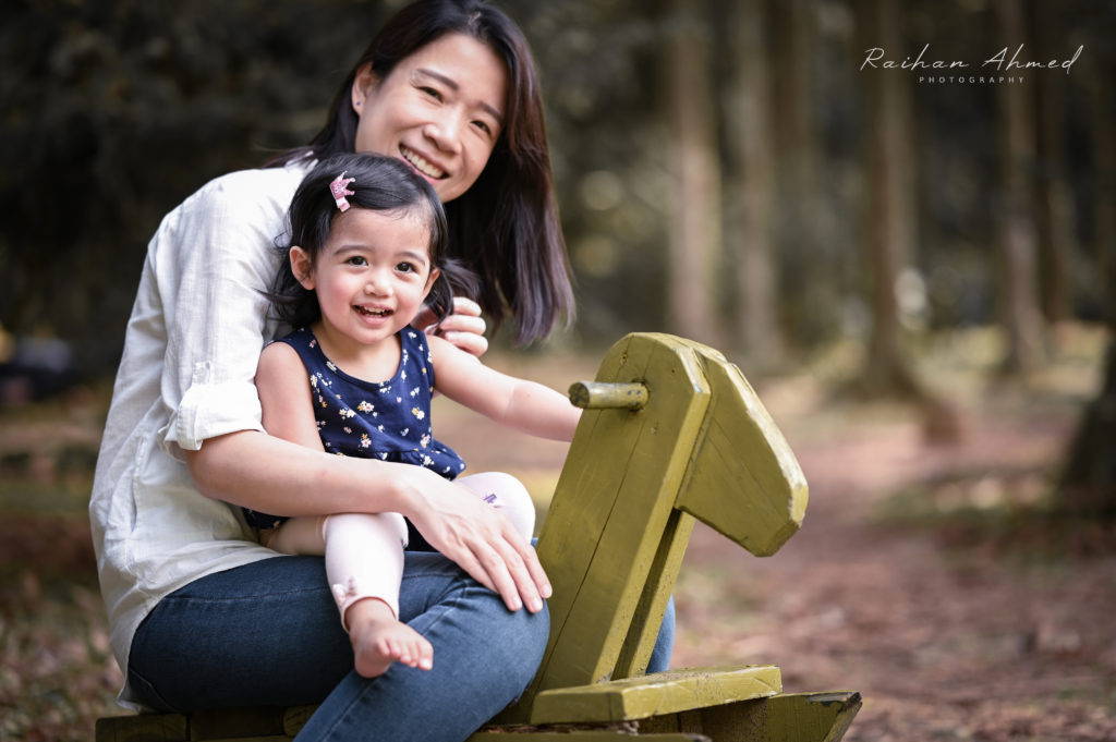 Mother and daughter on rocking horse