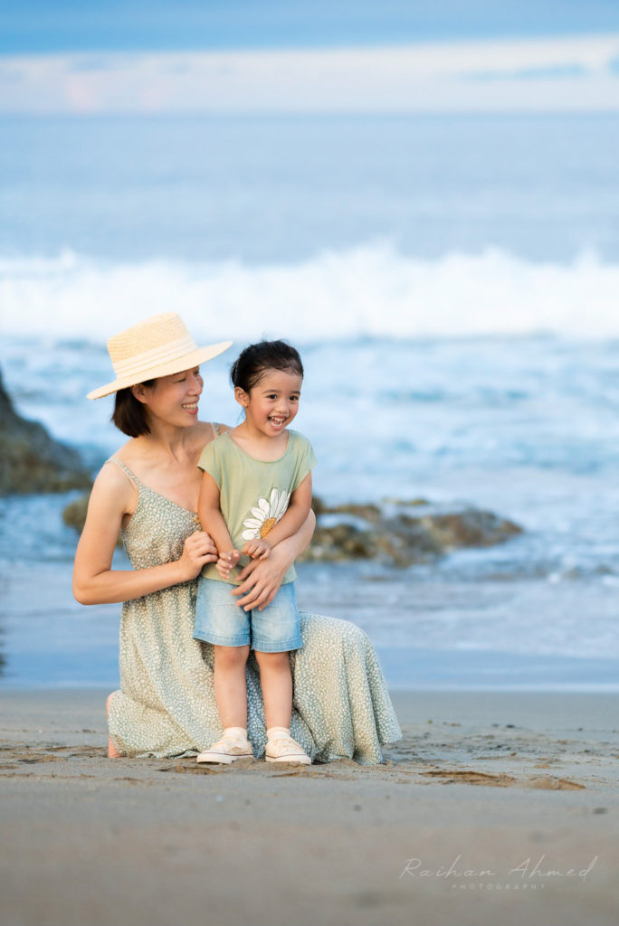 Photo of mother and daughter at the beach