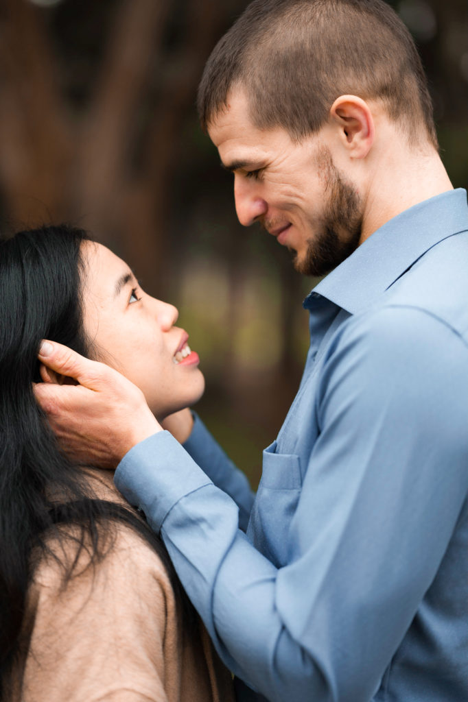 Photo of a couple looking into each other's eyes.