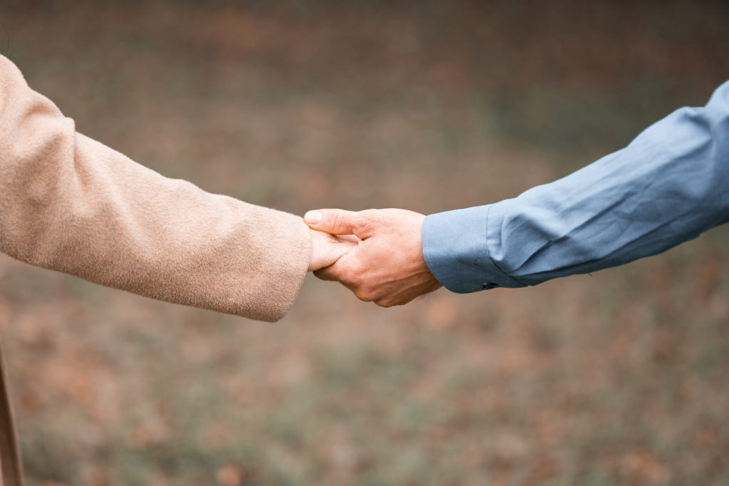 Photo of a couple holding hands