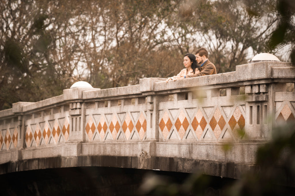 Photo of a couple on a bridge