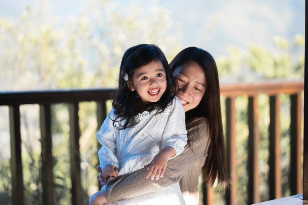 Photo of a mother and daughter sitting happily