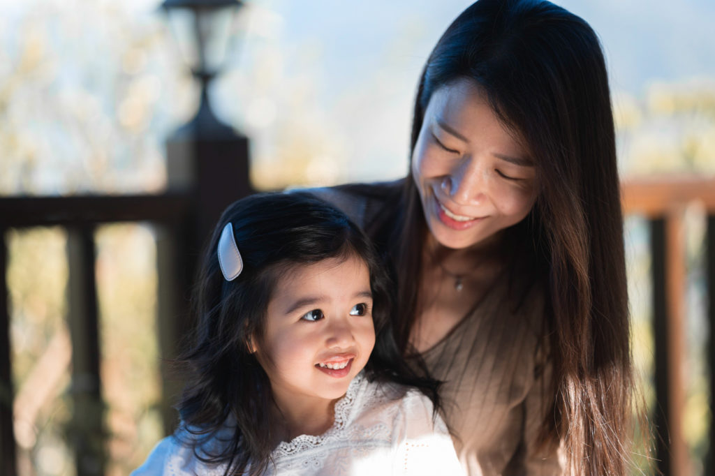 Photo of a mother looking lovingly at her daughter