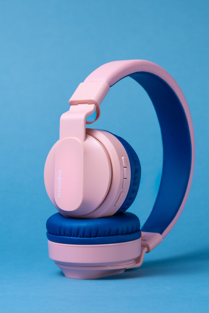 Pink headphones on blue background