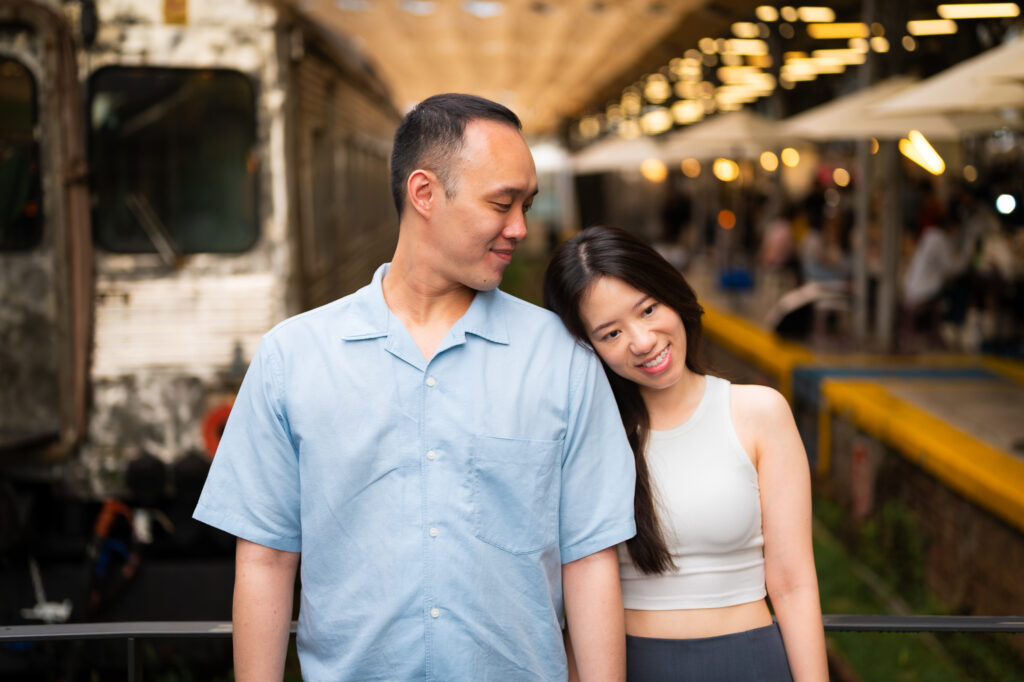 Couple standing at train station