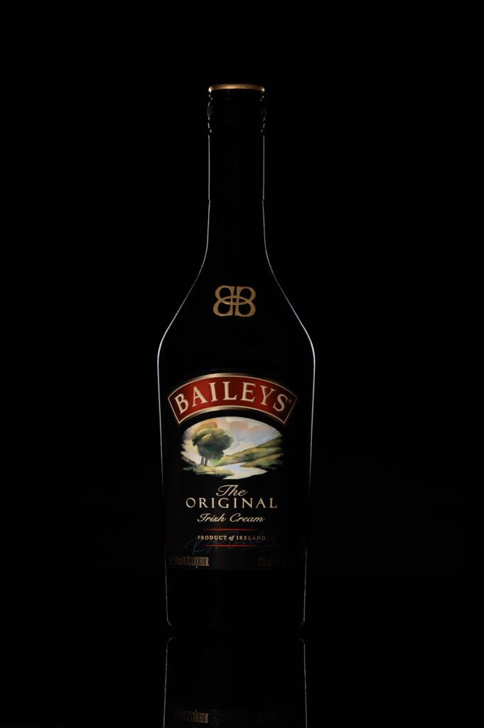 Bottle of Baileys on black background